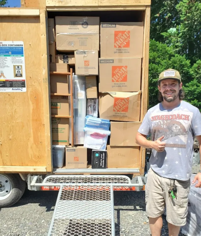 Tyler Smith with packed moving truck
